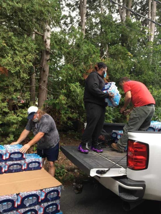 volunteers loading water