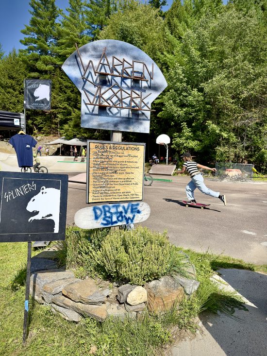 A skater girl pushes through warren skatepark